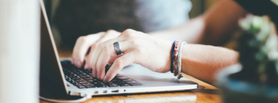 An image of someone filling a form in on a laptop